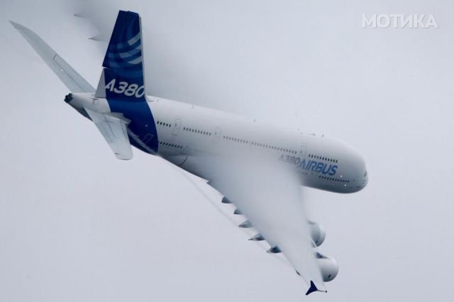 An Airbus A380, the world's largest jetliner, generates vortex during a flying display at the 51st Paris Air Show at Le Bourget airport near Paris