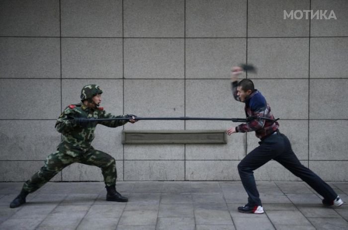 Paramilitary policemen participate in a night drill, in preparation for the coming 18th National Congress of the Communist Party of China, in Taiyuan