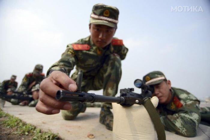 Paramilitary policemen snipers practice during an annual drill in Nanjing