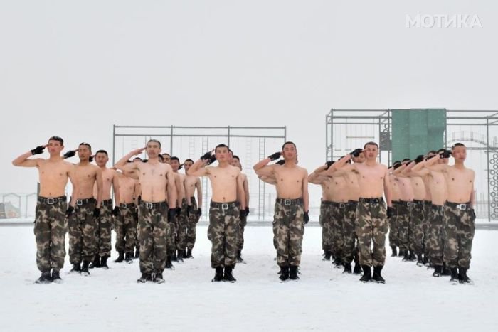 Paramilitary policemen take part in a winter training session at a snow field in Kashgar
